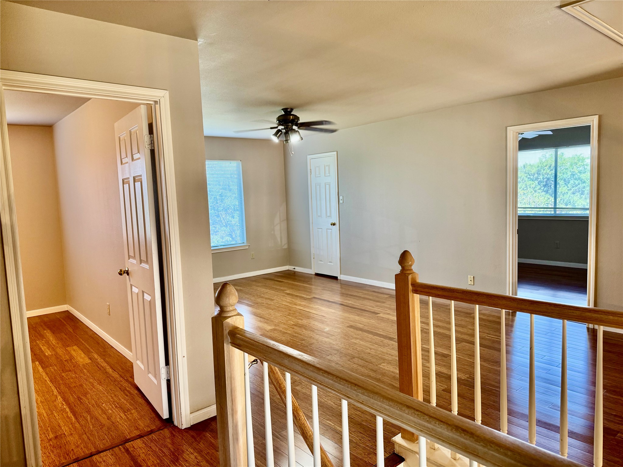 5817 Taylor Draper Cove Austin, TX 78759 - Photo 14 of 28 a view of a hallway with wooden floor and staircase