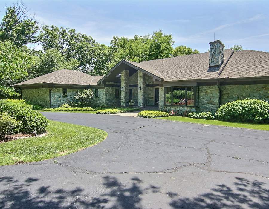 2774 Spring Creek Road Rockford, IL 61107 - Photo 1 of 25 a front view of a house with a yard and potted plants