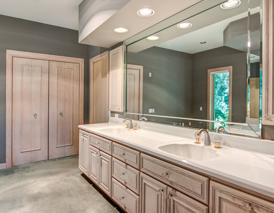 2774 Spring Creek Road Rockford, IL 61107 - Photo 14 of 25 a bathroom with double sink and a mirror