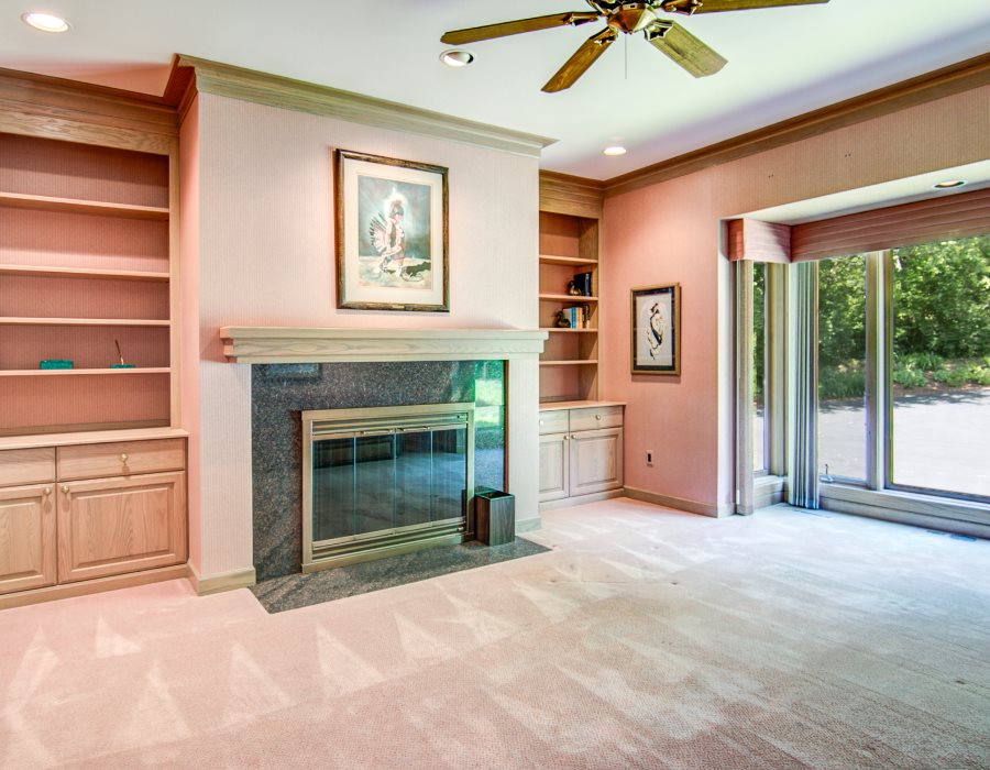 2774 Spring Creek Road Rockford, IL 61107 - Photo 16 of 25 a view of an empty room with a fireplace and a window
