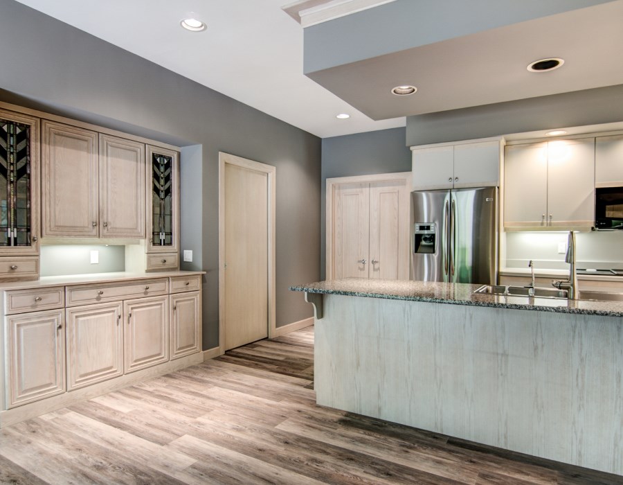 2774 Spring Creek Road Rockford, IL 61107 - Photo 10 of 25 a large kitchen with kitchen island a sink stainless steel appliances and cabinets