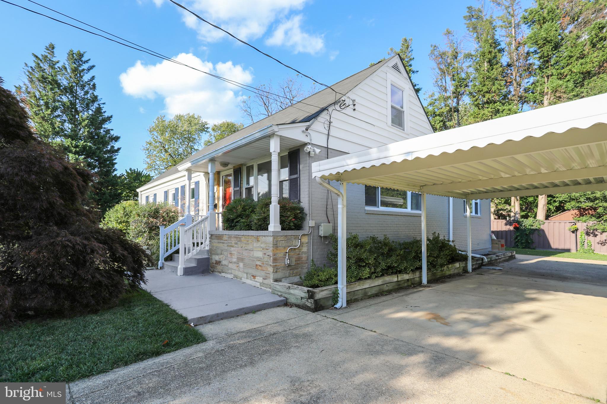 513 Harding Drive Silver Spring, MD 20901 - Photo 33 of 36 Long driveway with carport
