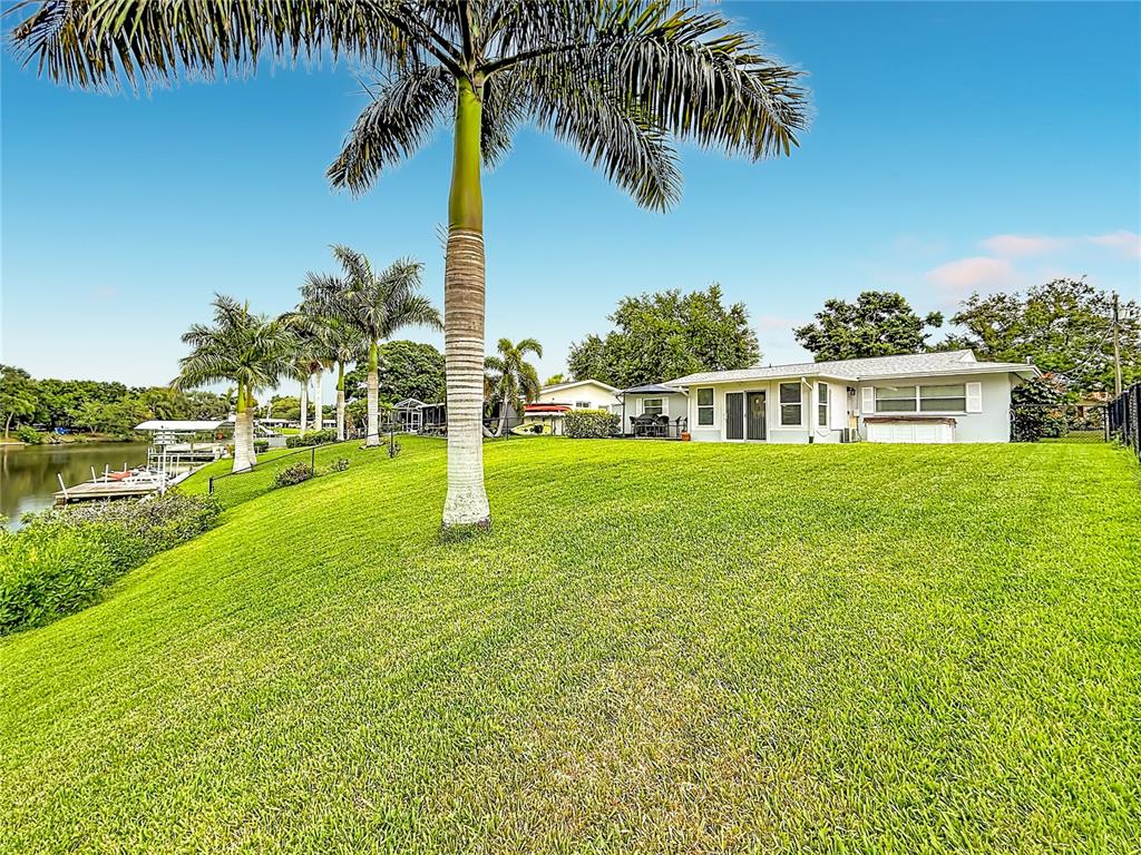 508 Shore Drive Largo, FL 33771 - Photo 25 of 31 a house with garden in front of it