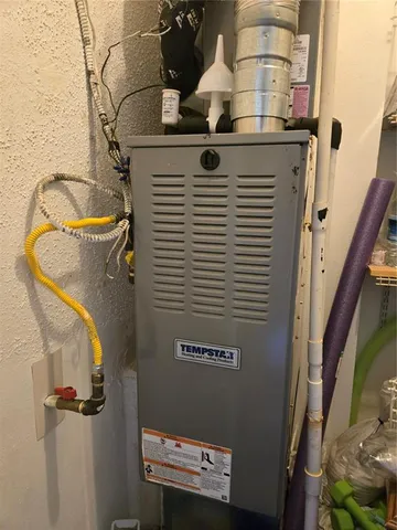 a close view of a utility room with dryer and washer