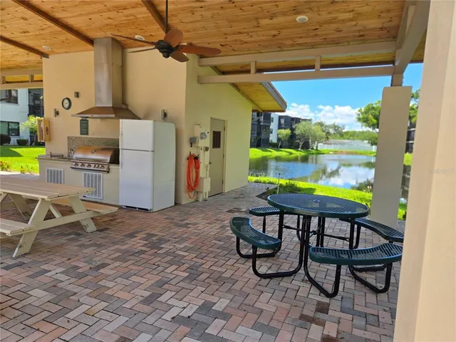 a view of a chairs and table in the patio