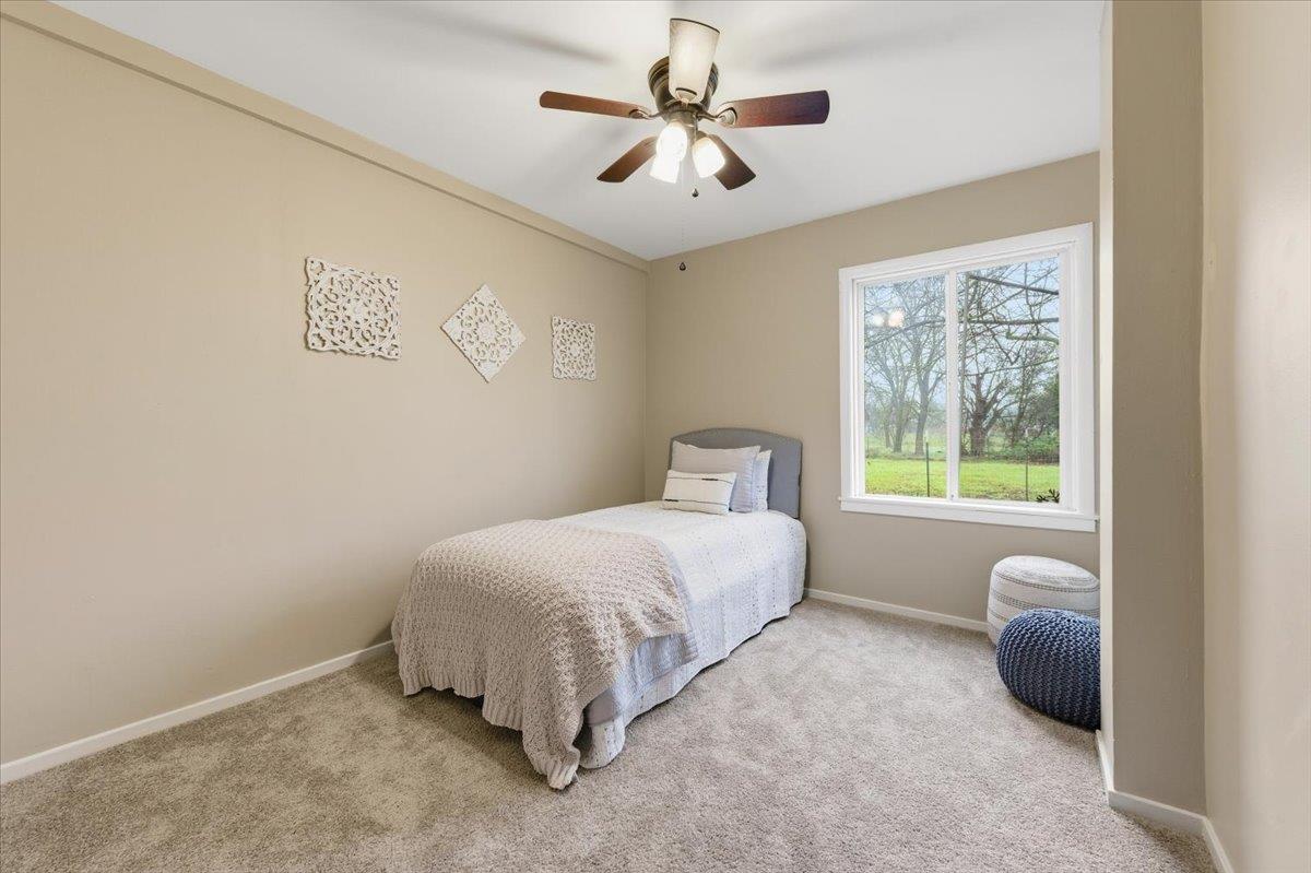 320 West Wise Road Lincoln, CA 95648 - Photo 12 of 28 a bedroom with a bed and a window