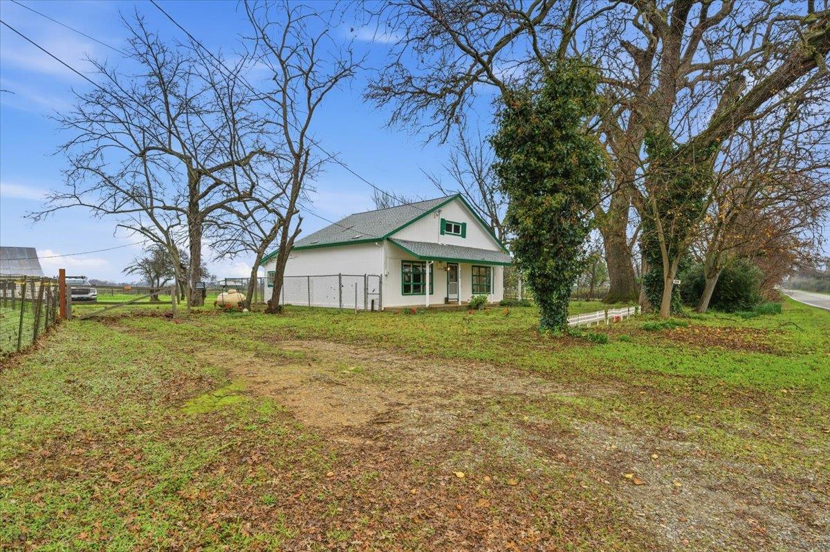 320 West Wise Road Lincoln, CA 95648 - Photo 19 of 28 a front view of house with yard and green space
