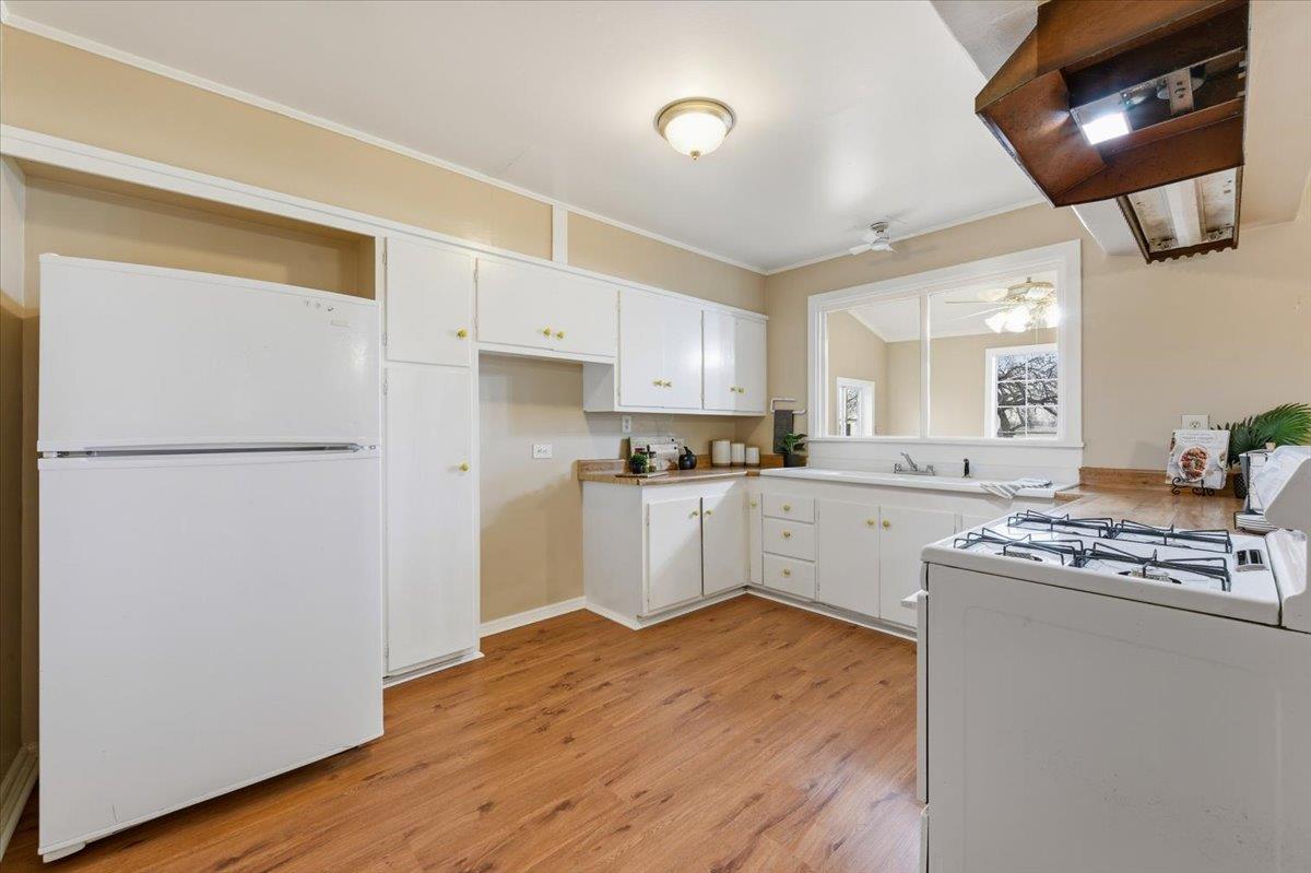 320 West Wise Road Lincoln, CA 95648 - Photo 6 of 28 a kitchen with stainless steel appliances granite countertop a refrigerator a stove and a wooden floors