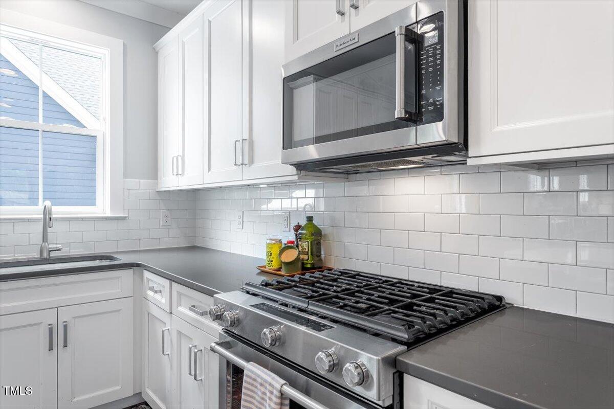 811 East Lane Street Raleigh, NC 27601 - Photo 16 of 35 a stove top oven sitting inside of a kitchen