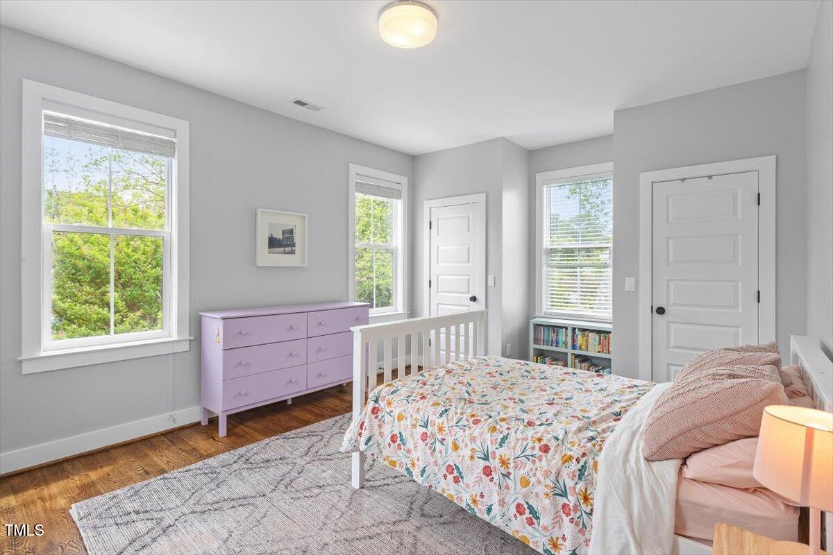 811 East Lane Street Raleigh, NC 27601 - Photo 21 of 35 a bedroom with a bed and a window