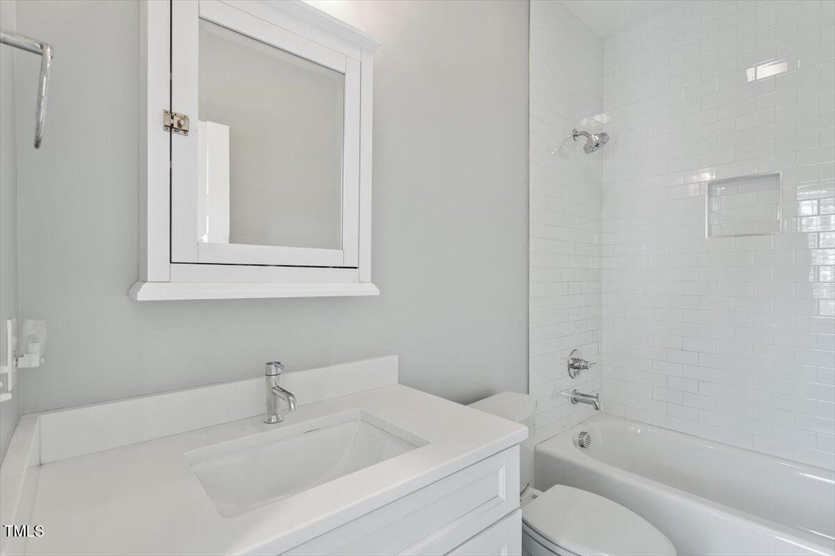 811 East Lane Street Raleigh, NC 27601 - Photo 22 of 35 a bathroom with a sink toilet and shower