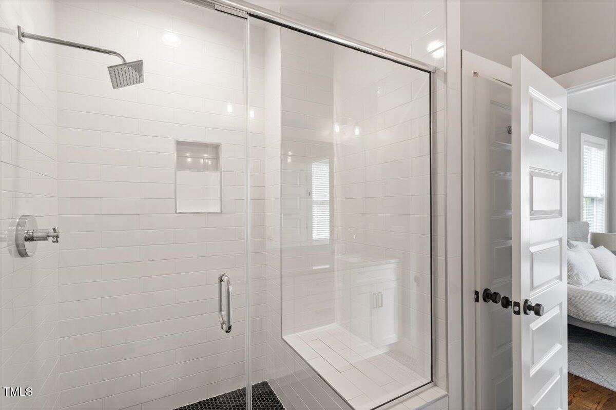 811 East Lane Street Raleigh, NC 27601 - Photo 31 of 35 a bathroom with a glass shower door