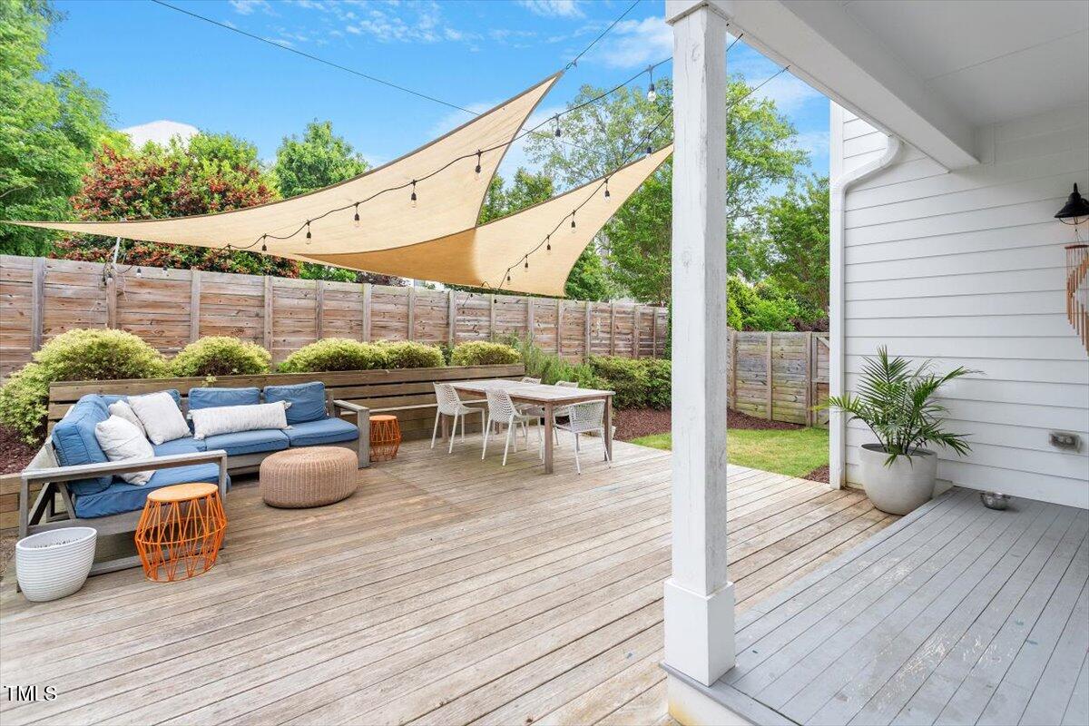 811 East Lane Street Raleigh, NC 27601 - Photo 7 of 35 a view of a patio with lawn chairs and wooden floor
