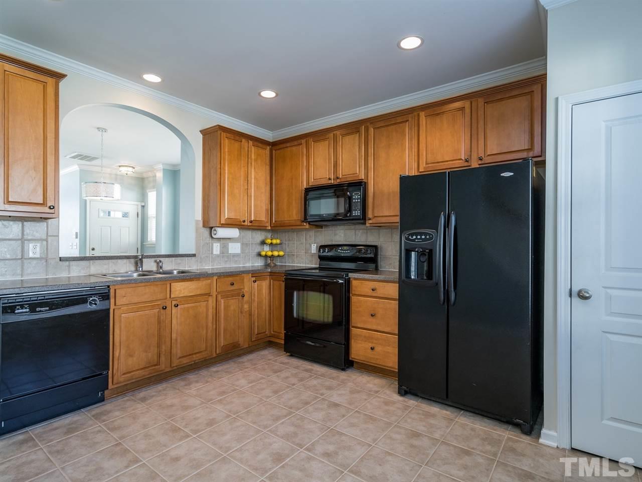 4414 Sugarbend Way Raleigh, NC 27606 - Photo 11 of 24 The well-appointed kitchen is spacious and will be a joy to cook in.