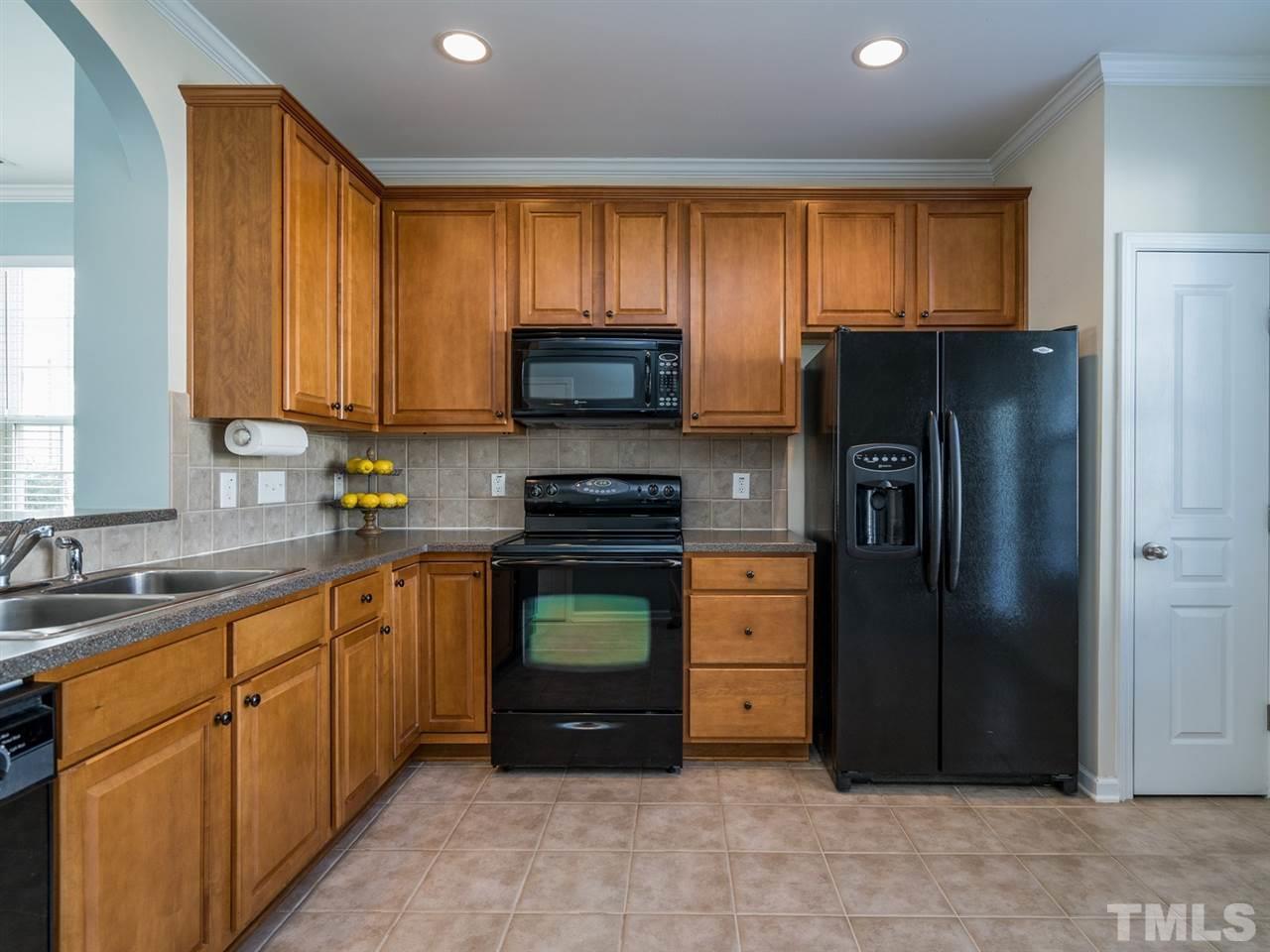 4414 Sugarbend Way Raleigh, NC 27606 - Photo 12 of 24 You will find considerable counter and cabinet storage in addition to a pantry.