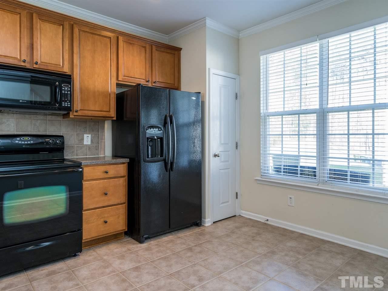4414 Sugarbend Way Raleigh, NC 27606 - Photo 13 of 24 The kitchen gets lots of natural light.