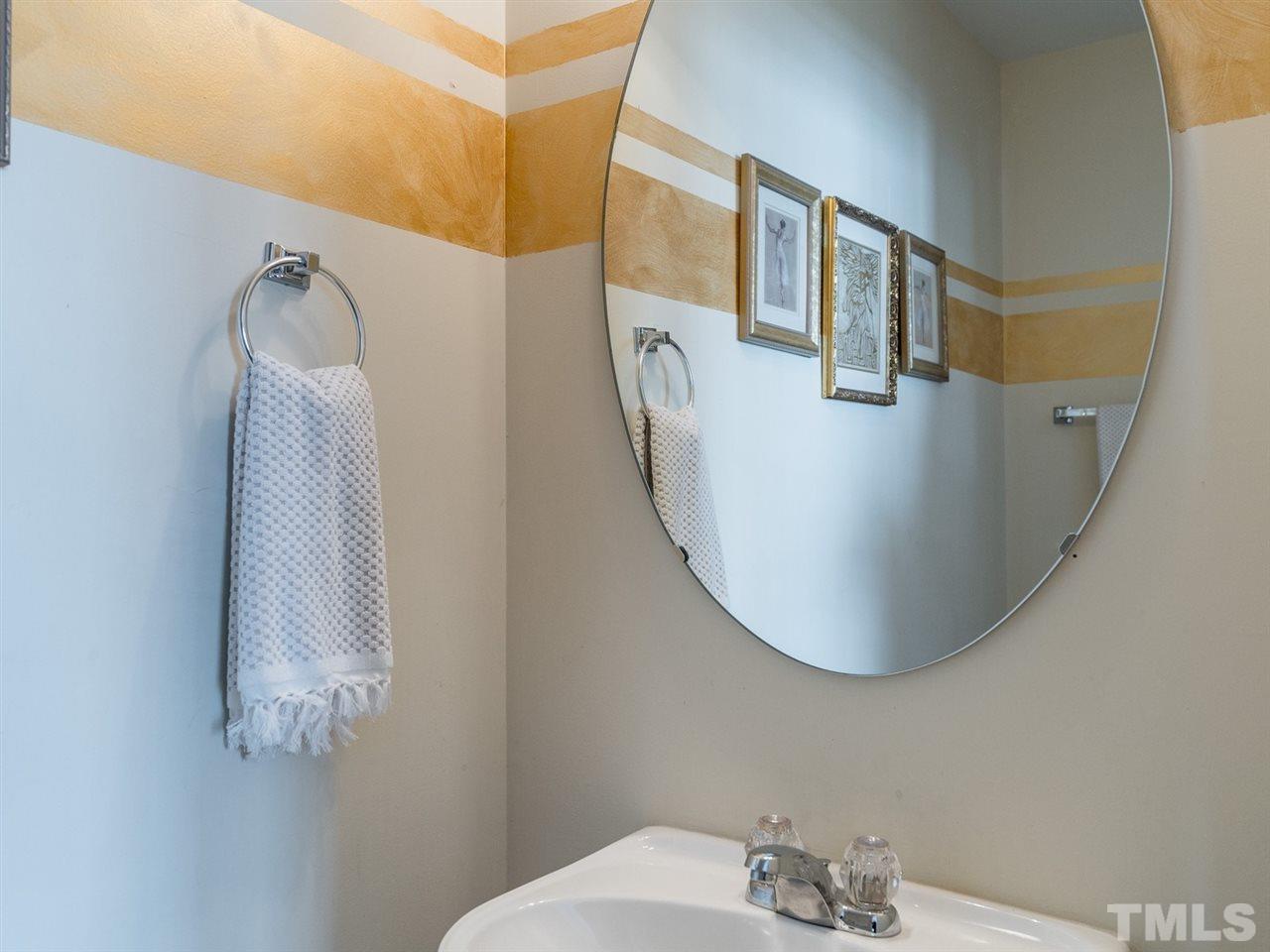 4414 Sugarbend Way Raleigh, NC 27606 - Photo 15 of 24 The half bath is located on the first floor.