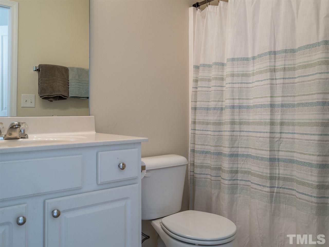 4414 Sugarbend Way Raleigh, NC 27606 - Photo 21 of 24 This bathroom has a tub/shower combination as well.
