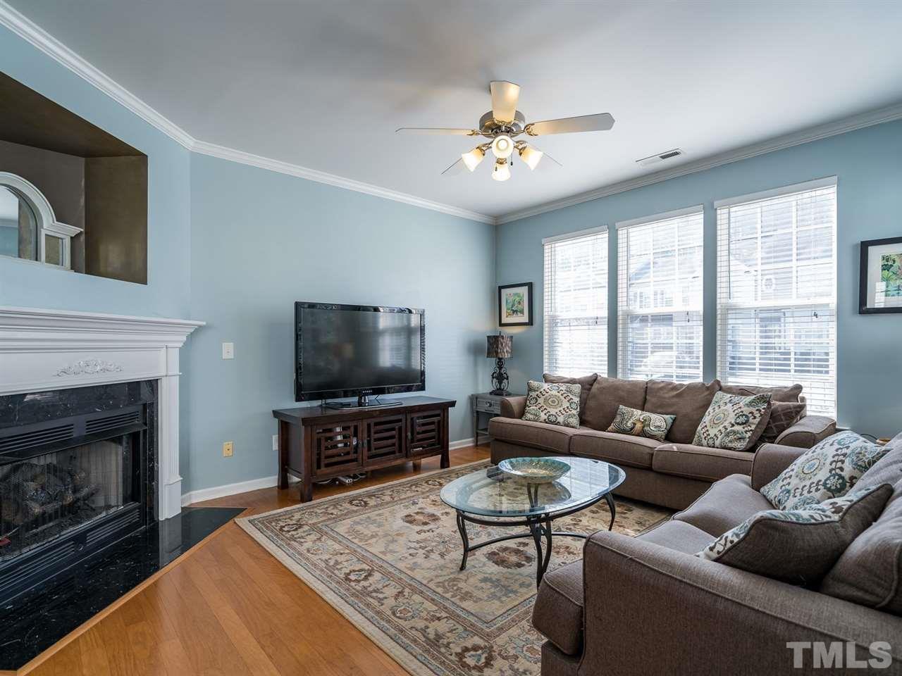 4414 Sugarbend Way Raleigh, NC 27606 - Photo 5 of 24 Friends and family will enjoy spending time by the fireplace on cool North Carolina days.