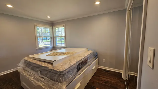 a room with a bed and a window