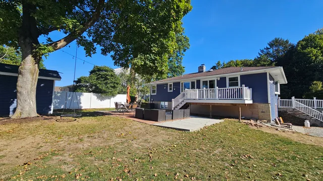a view of a house with a yard