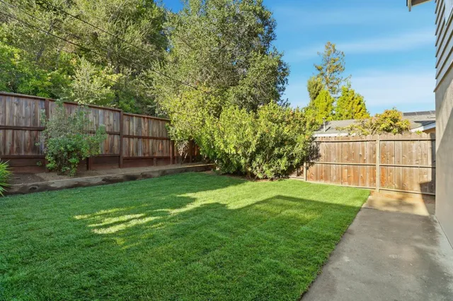 a view of a backyard with a garden