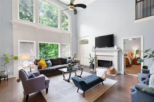 a living room with furniture and a large window
