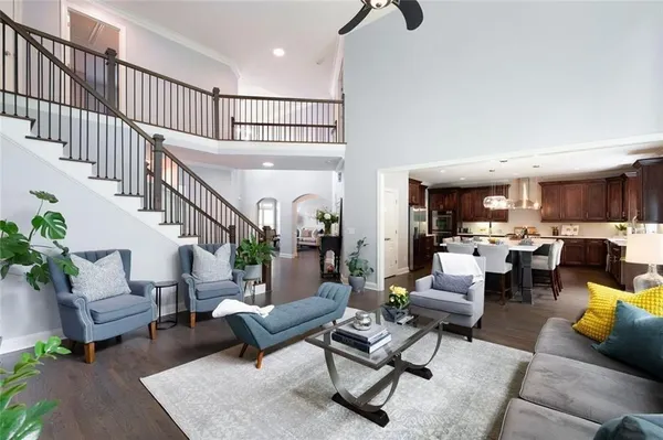 a living room with furniture fireplace and a flat screen tv