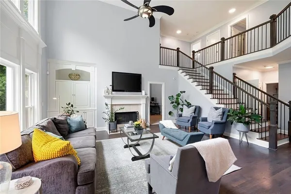 a kitchen with a sink and chairs