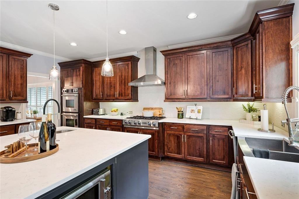 3045 Moss Stone Lane Southwest Marietta, GA 30064 - Photo 18 of 65 a kitchen with kitchen island granite countertop a sink stove and cabinets