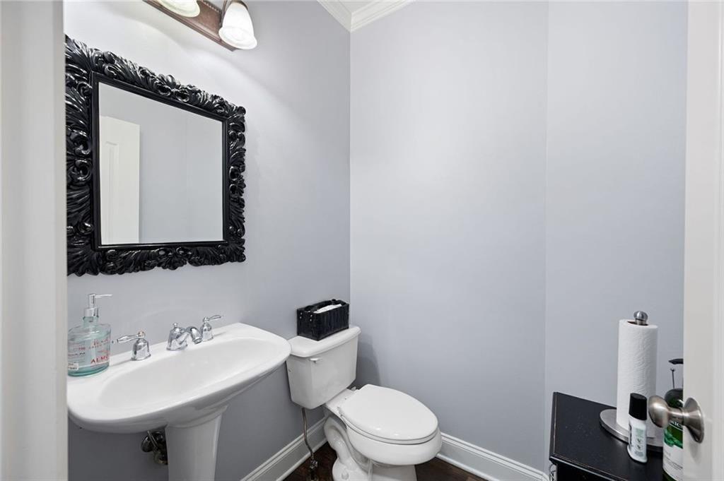 3045 Moss Stone Lane Southwest Marietta, GA 30064 - Photo 25 of 65 a bathroom with a toilet sink and mirror