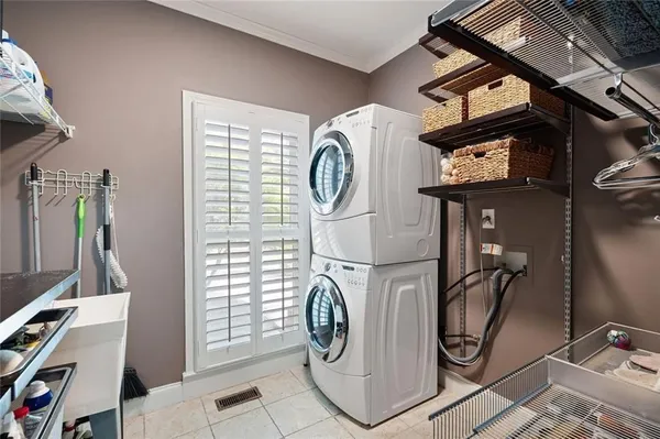 a bedroom with a bed and a television