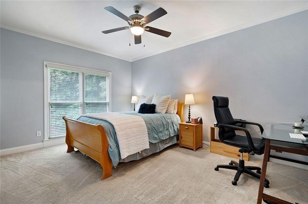 3045 Moss Stone Lane Southwest Marietta, GA 30064 - Photo 36 of 65 a bedroom with a bed and a desk