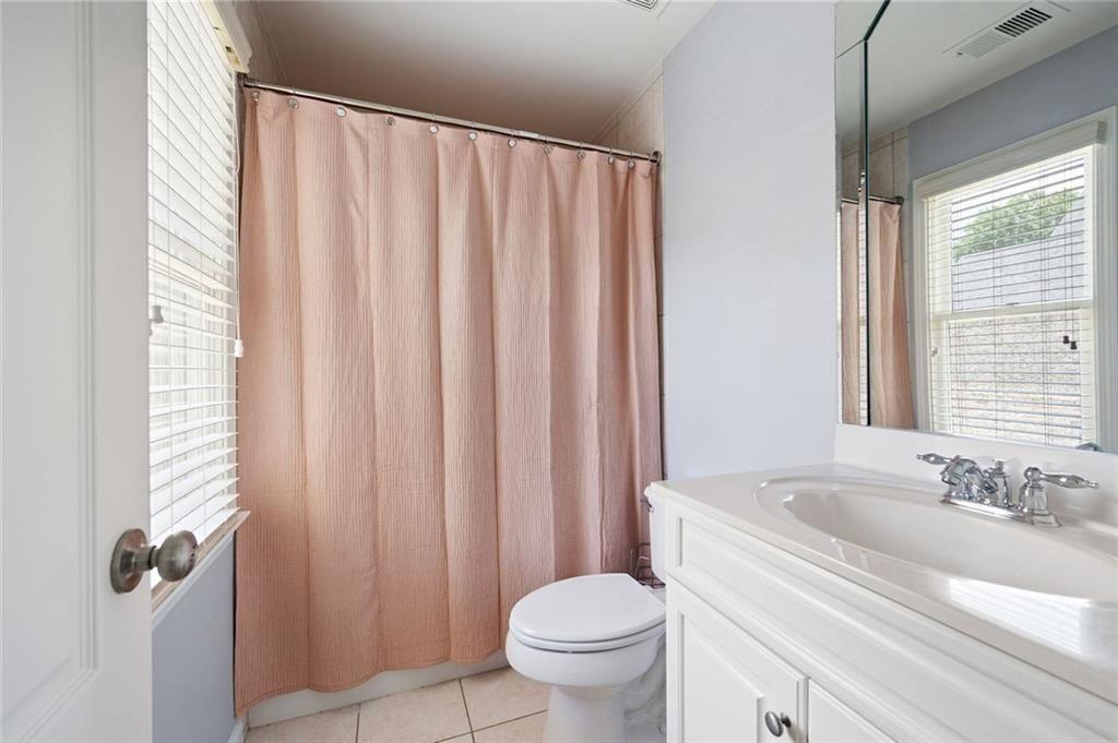 3045 Moss Stone Lane Southwest Marietta, GA 30064 - Photo 39 of 65 a bathroom with a sink a toilet and a mirror