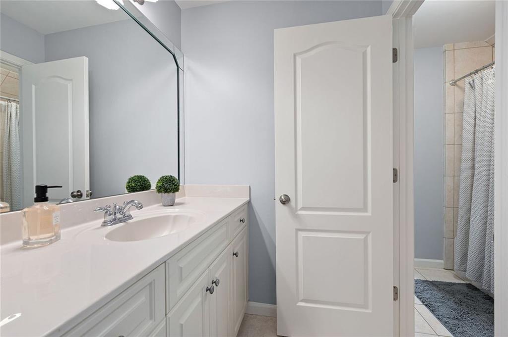 3045 Moss Stone Lane Southwest Marietta, GA 30064 - Photo 41 of 65 a bathroom with a sink and a mirror