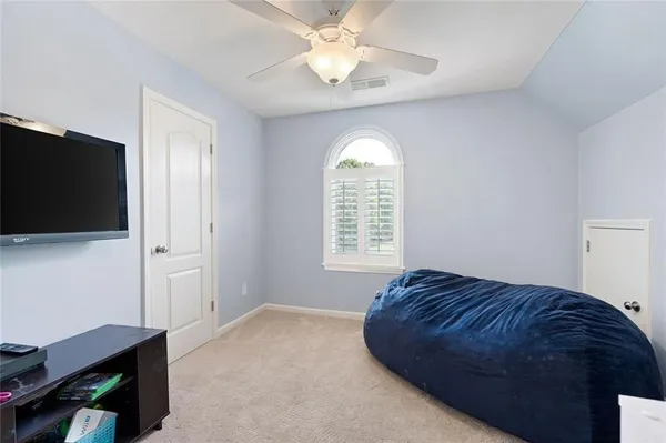 a view of a room with furniture and wooden floor