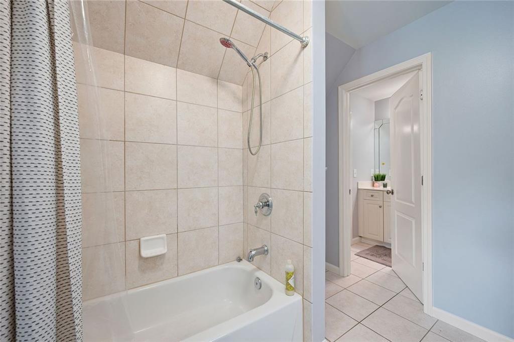 3045 Moss Stone Lane Southwest Marietta, GA 30064 - Photo 43 of 65 a bathroom with a bathtub and a shower