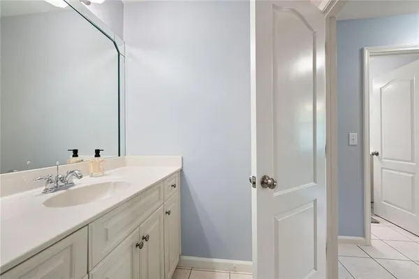 a view of deck with furniture and trees