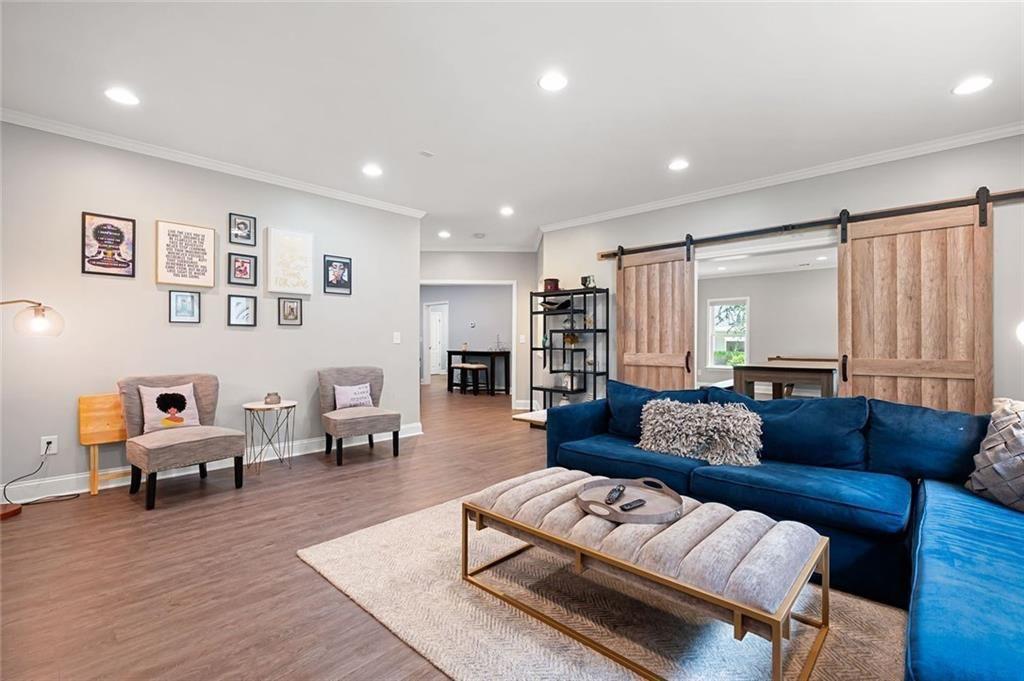 3045 Moss Stone Lane Southwest Marietta, GA 30064 - Photo 49 of 65 a living room with furniture and a wooden floor