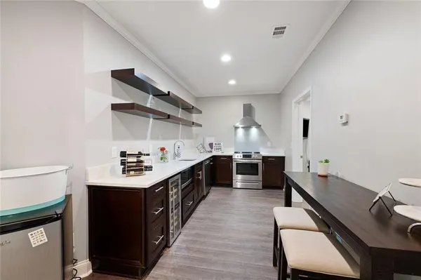 an aerial view of a house with a yard and pool