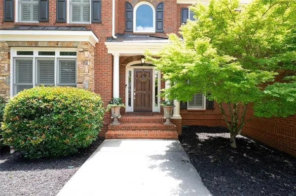 a view of a house with a garden