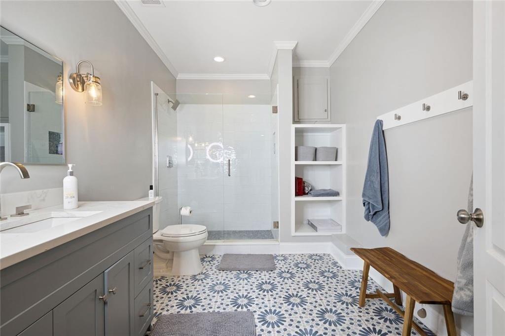 3045 Moss Stone Lane Southwest Marietta, GA 30064 - Photo 54 of 65 a bathroom with a sink a toilet and shower