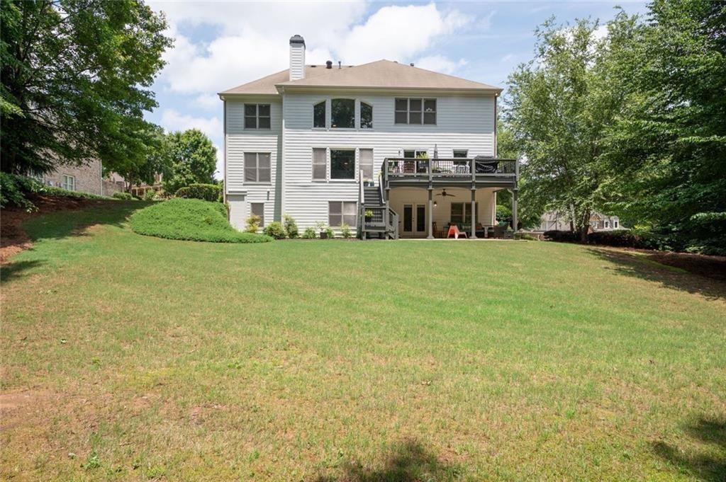 3045 Moss Stone Lane Southwest Marietta, GA 30064 - Photo 60 of 65 a view of a house with a garden and yard