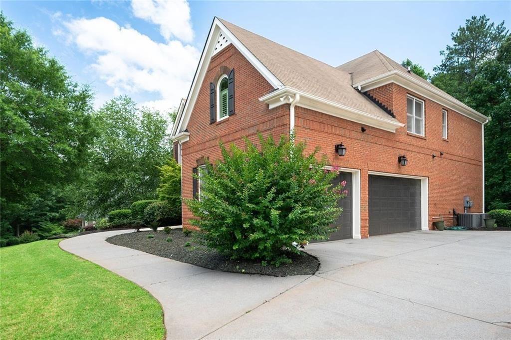 3045 Moss Stone Lane Southwest Marietta, GA 30064 - Photo 62 of 65 a front view of a house with garden
