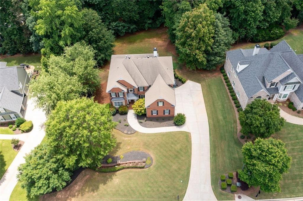 3045 Moss Stone Lane Southwest Marietta, GA 30064 - Photo 64 of 65 an aerial view of a house with a yard and pool