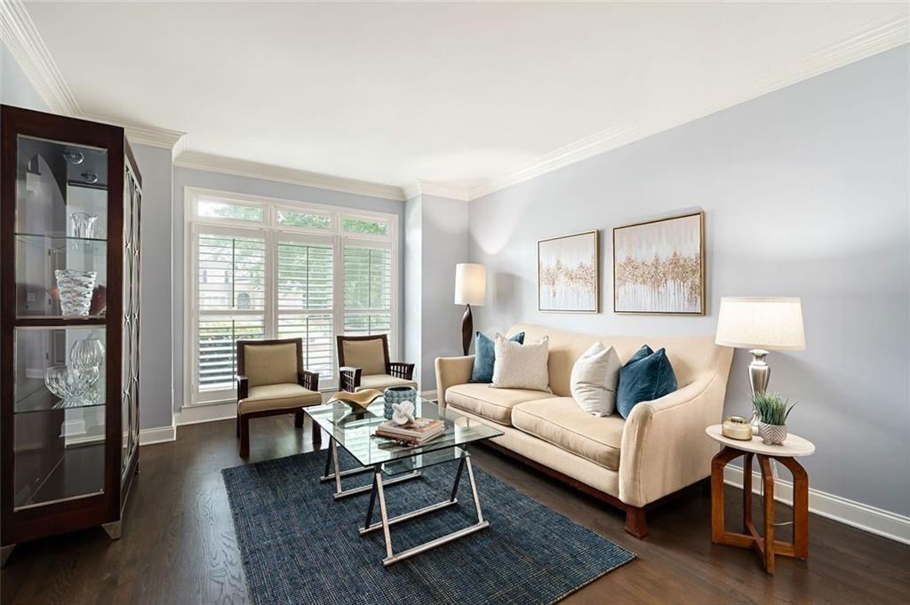 3045 Moss Stone Lane Southwest Marietta, GA 30064 - Photo 10 of 65 a living room with furniture wooden floor and a large window