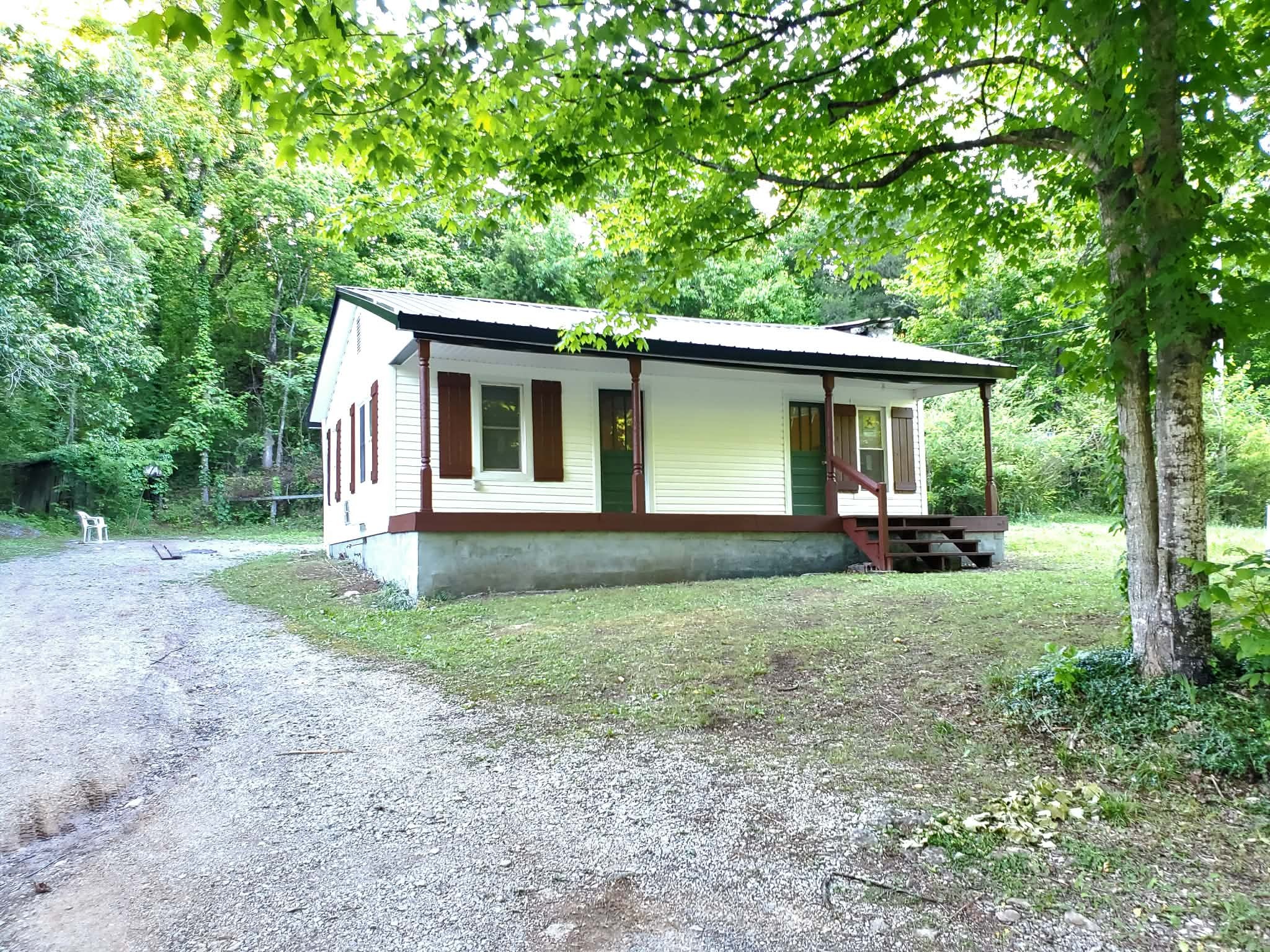 210 Rawls Creek Road Gordonsville, TN 38563 - Photo 1 of 13 a view of backyard of house with green space