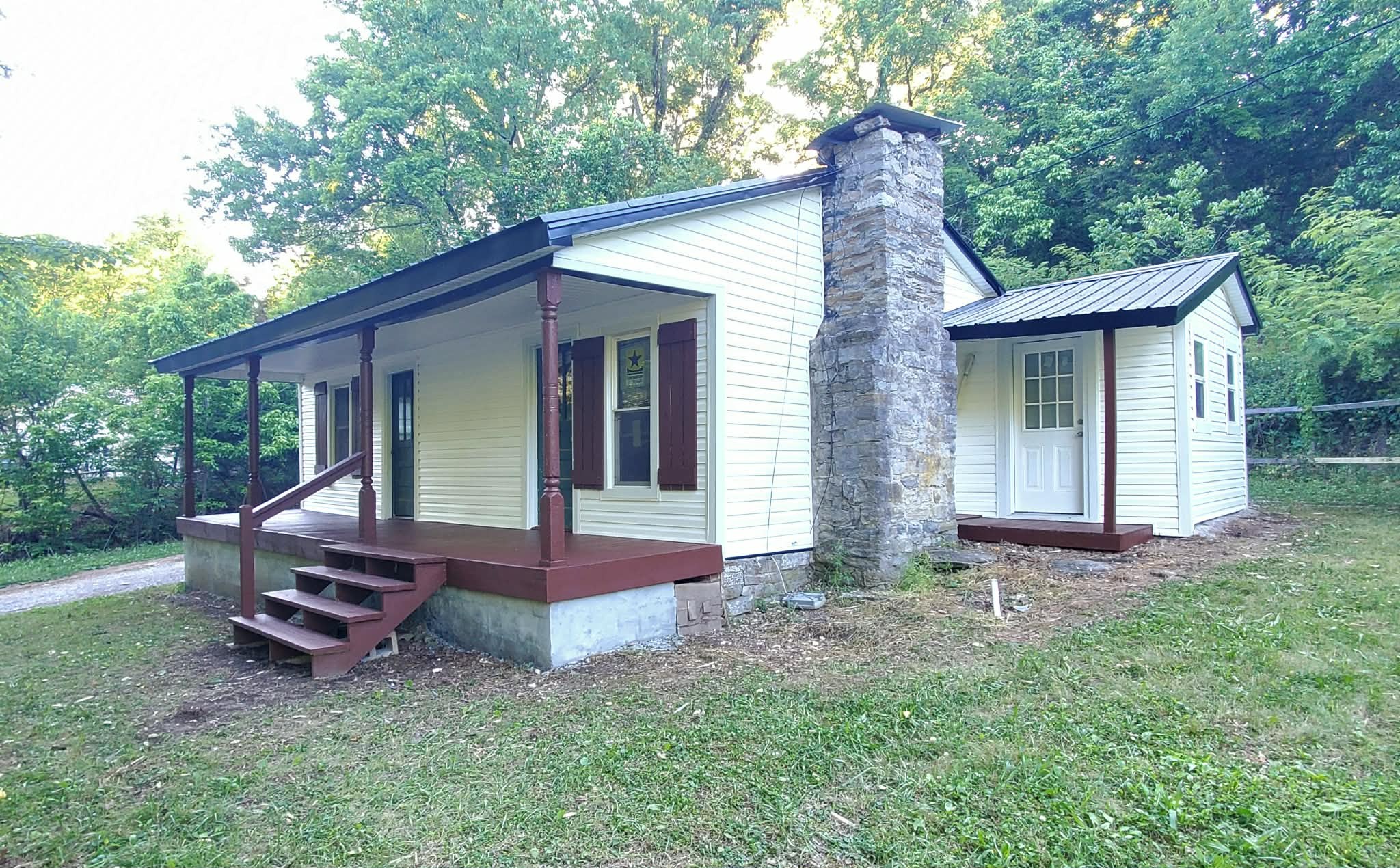 210 Rawls Creek Road Gordonsville, TN 38563 - Photo 2 of 13 a view of a house with a yard