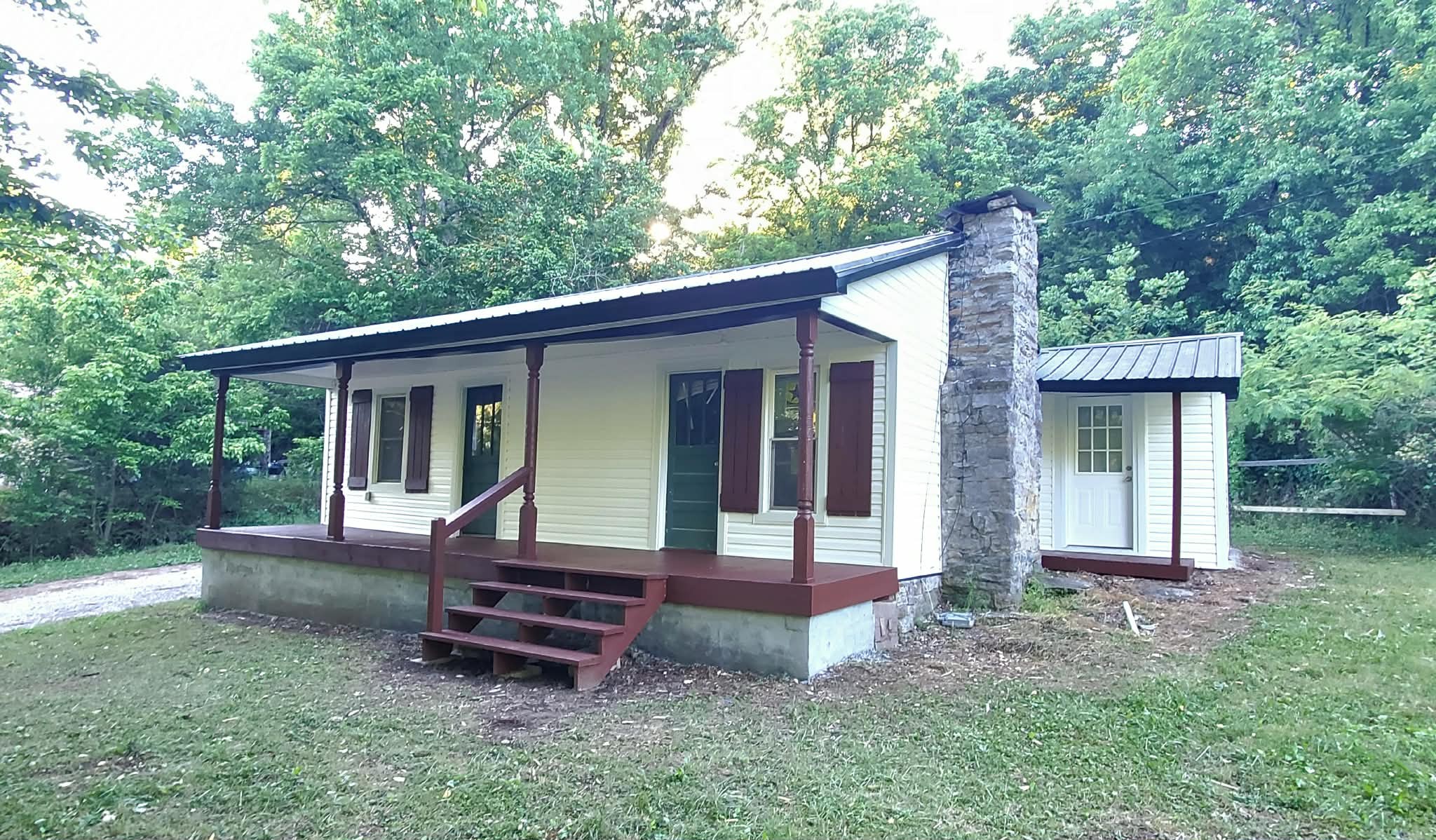 210 Rawls Creek Road Gordonsville, TN 38563 - Photo 3 of 13 front view of a house with a yard