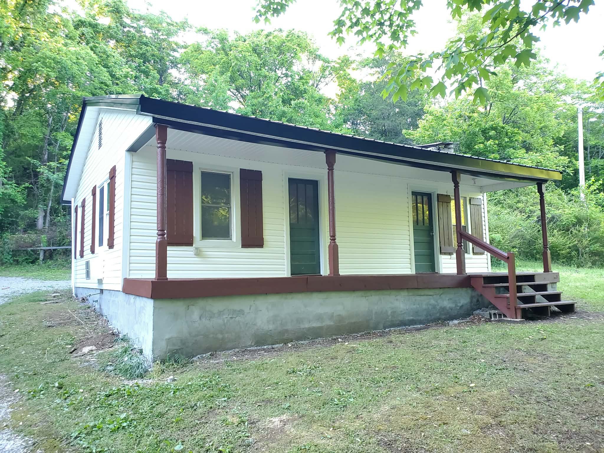 210 Rawls Creek Road Gordonsville, TN 38563 - Photo 4 of 13 a front view of a house with porch